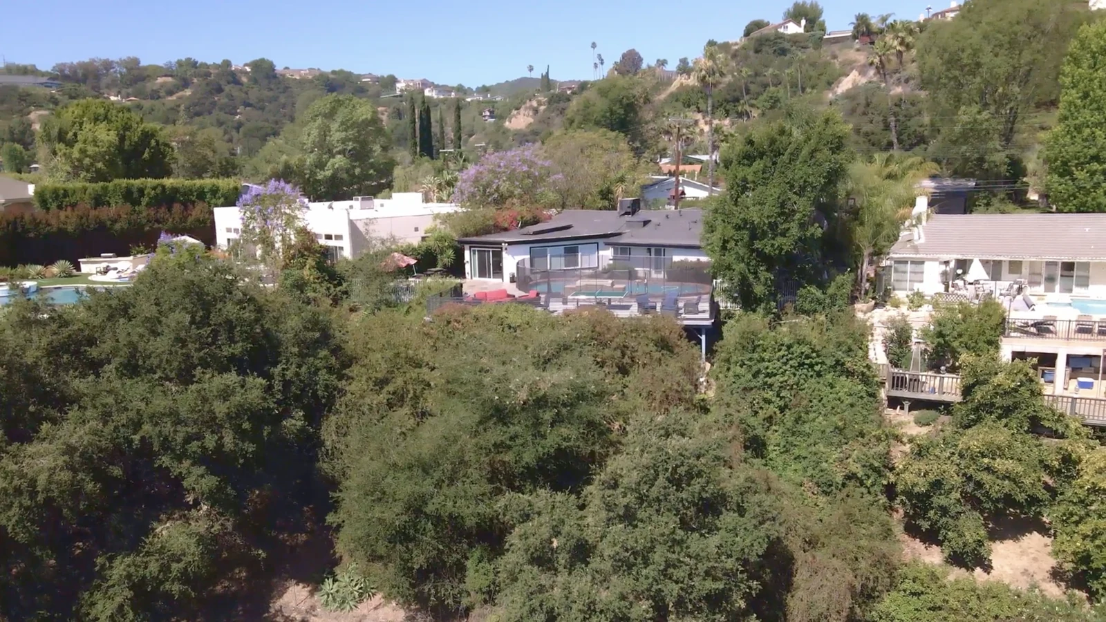 Aerial view of the LACATC facility in a wooded Los Angeles hillside neighborhood